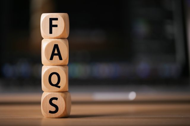 photo of vertically stacked wood cubes that spell out FAQS for the beginning of a FAQS section of text