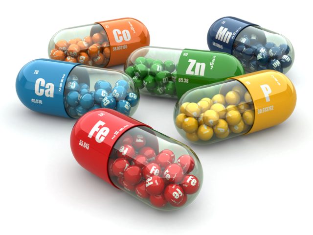 photo of many vitamin capsules in various colors
